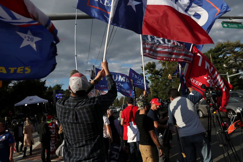 Supporters of U.S. President Donald Trump gather outside the Walter Reed National Military Medical Center in Bethesda