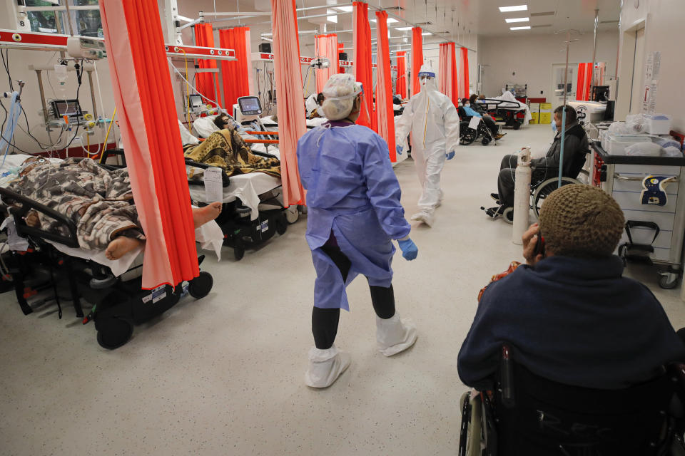 Patients lie on beds in the emergency room, turned into a CODIV-19 unit due the high number of cases, at the Bagdasar-Arseni hospital in Bucharest, Romania, Tuesday, Oct. 12, 2021. Romania reported on Tuesday nearly 17,000 new COVID-19 infections and 442 deaths, the highest number of coronavirus infections and deaths in a day since the pandemic started, as the nation's health care system struggles to cope with an acute surge of new cases.(AP Photo/Andreea Alexandru)