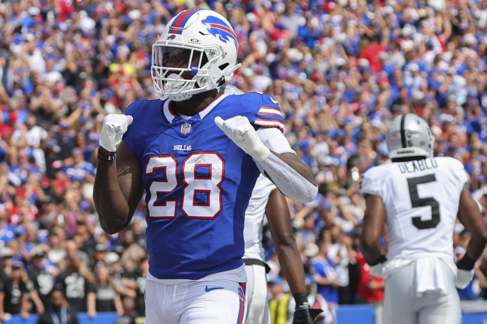 Buffalo Bills' Latavius Murray (28) celebrates in front of Las Vegas Raiders' Divine Deablo (5) after rushing for a touchdown during the first half of an NFL football game, Sunday, Sept. 17, 2023, in Orchard Park, N.Y. (AP Photo/Jeffrey T. Barnes)