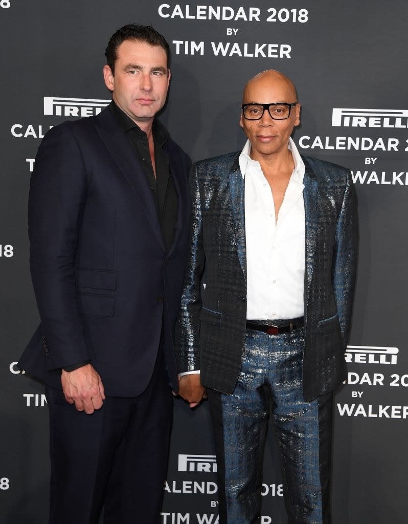 LeBar and RuPaul holding hands at an event