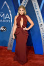 <p>Alaina kept her look monochromatic, with burgundy earrings to match her dress. (Photo: Getty Images) </p>