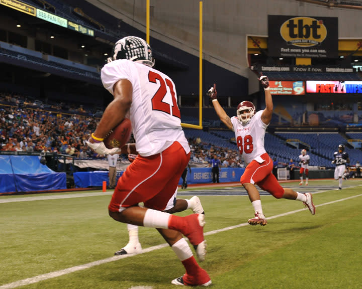 ST. PETERSBURG, FL - JANUARY 21: Wide receiver B. J. Cunningham of the Michigan State University Spartans runs for a first-quarter touchdown during the 87th annual East-West Shrine game January 21, 2012 at Tropicana Field in St. Petersburg, Florida. (Photo by Al Messerschmidt/Getty Images)