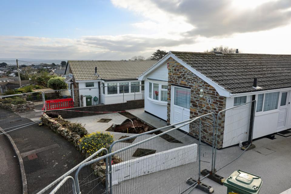 A fence has been erected around a property in White House Close in Carbis Bay where a mineshaft has opened up in the front garden.

Credit: CornwallLive/BPM