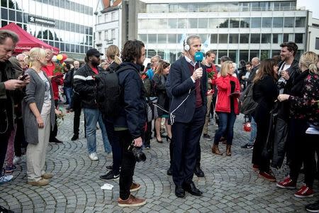 Norway's Labour Party leader Jonas Gahr Store talks to a radio station during an election campaign event in Stavanger, Norway September 9, 2017. NTB Scanpix/Carina Johansen/via REUTERS