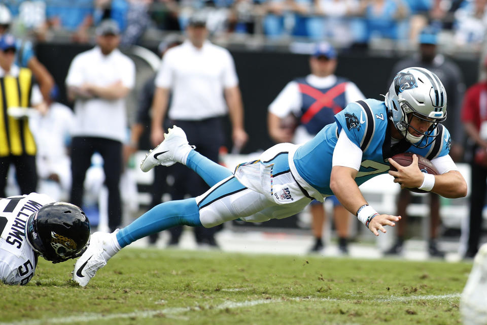 Carolina Panthers quarterback Kyle Allen (7) dives while Jacksonville Jaguars linebacker Quincy Williams (56) tackles during the second half of an NFL football game in Charlotte, N.C., Sunday, Oct. 6, 2019. (AP Photo/Brian Blanco)