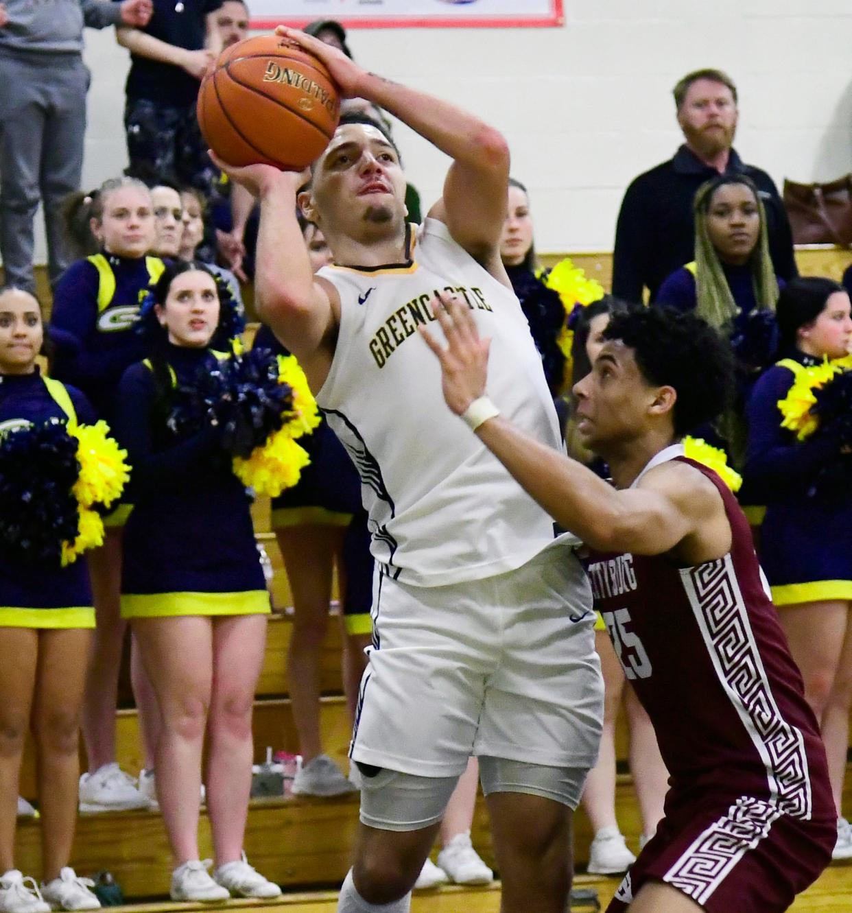 Surzano Soloman of Greencastle shoots over Gettysburg's Kayson Johnson during the Blue Devils' overtime victory. Soloman and the rest of the squad won the Mid-Penn Colonial Division, earning a chance to play in the conference tournament.