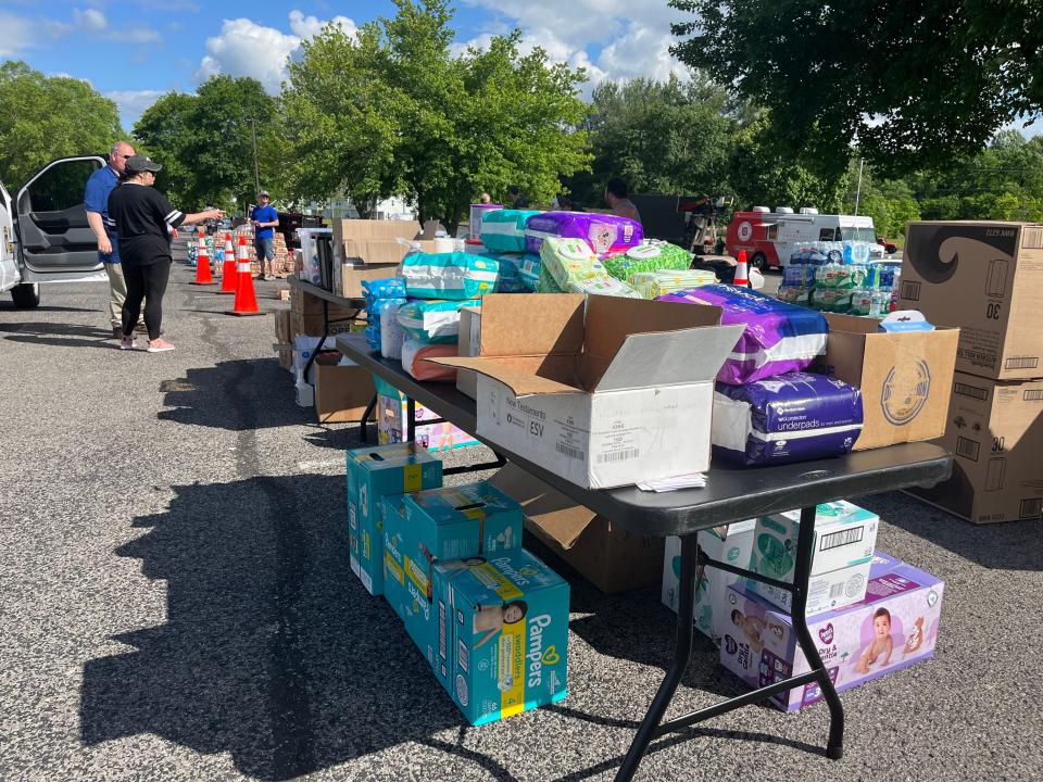 Supplies are stacked high on tables at Randolph Howell Elementary School, a recovery hub for those impacted by the tornado on Friday, May 10, 2024 in Columbia, Tenn.