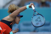 Naomi Osaka, of Japan, serves to Alison Riske during the Miami Open tennis tournament, Monday, March 28, 2022, in Miami Gardens, Fla. (AP Photo/Wilfredo Lee)