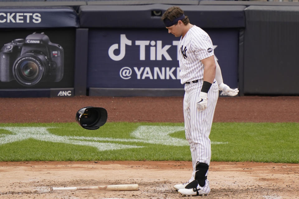 New York Yankees Luke Voit (59) tosses his helmet after striking out in the fifth inning of a baseball gam against the Baltimore Orioles, Sunday, Sept. 13, 2020, at Yankee Stadium in New York. (AP Photo/Kathy Willens)