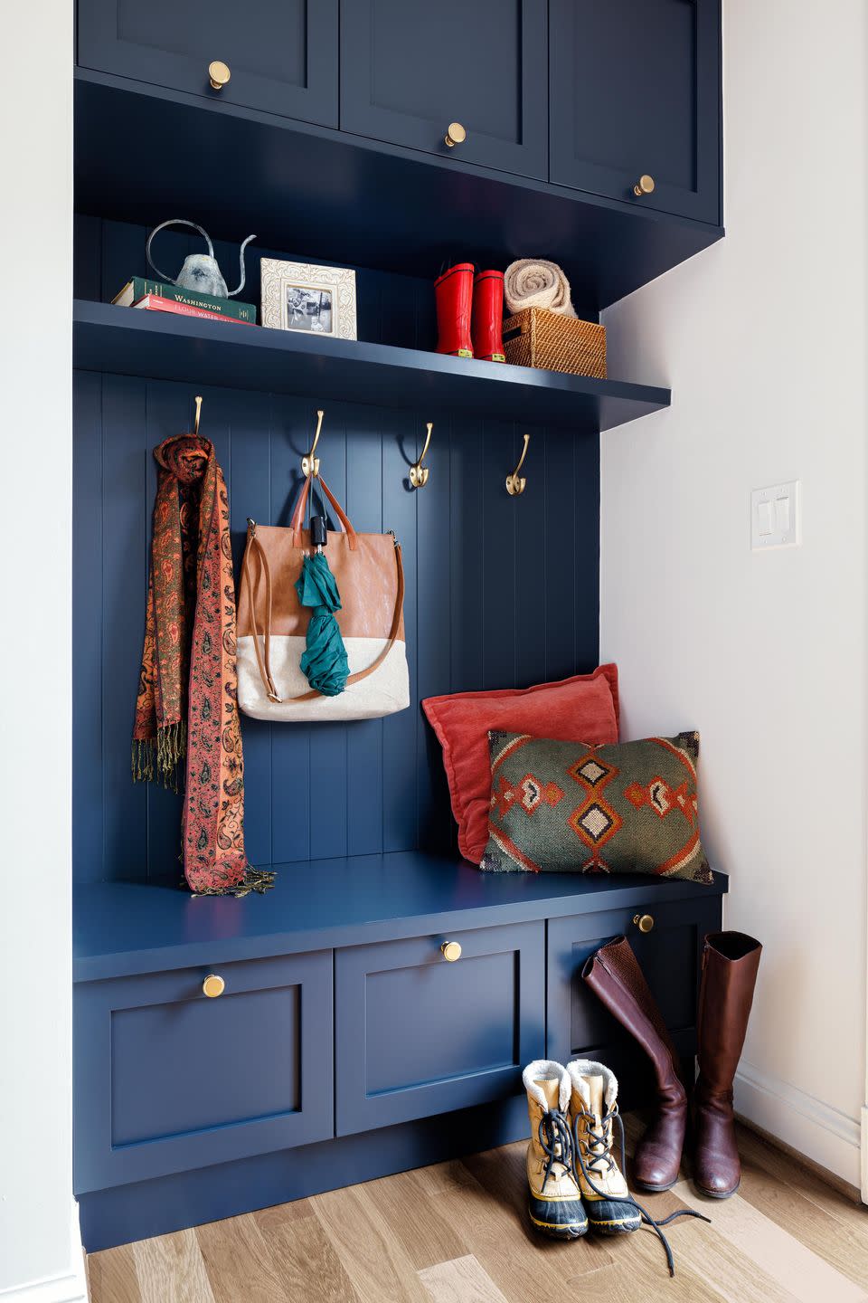 entryway with blue built in cabinets