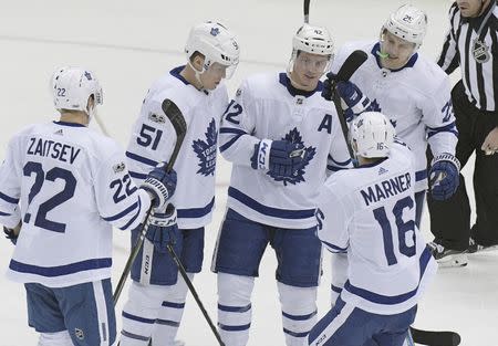 Dec 9, 2017; Pittsburgh, PA, USA; Toronto Maple Leafs center Tyler Bozak (42) celebrates with defenseman Nikita Zaitsev (22) and defenseman Jake Gardiner (51) and left wing James van Riemsdyk (25) and center Mitchell Marner (16) after scoring against the Pittsburgh Penguins during the second period at PPG PAINTS Arena. Mandatory Credit: Don Wright-USA TODAY Sports