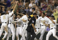Vanderbilt players celebrate their 6-5 win against Stanford during a baseball game in the College World Series Wednesday, June 23, 2021, at TD Ameritrade Park in Omaha, Neb. (AP Photo/Rebecca S. Gratz)