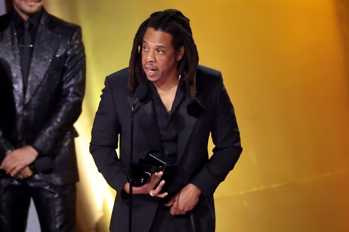Jay-Z accepting the Global Impact Award onstage during 2024 Grammy Awards (Getty Images)