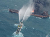 <p>A rescue ship works to extinguish the fire on the stricken Iranian oil tanker Sanchi in the East China Sea, on Jan. 10, 2018 in this photo provided by Japan’s 10th Regional Coast Guard. (Photo: 10th Regional Coast Guard Headquarters/Handout via Reuters) </p>