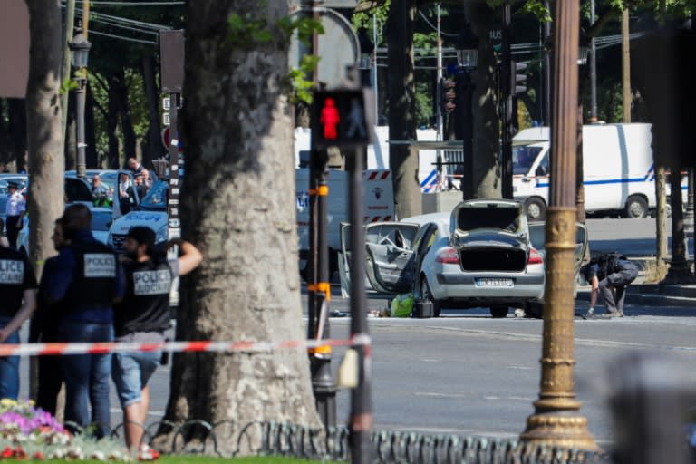 Authorities quickly sealed off the world-famous Champs-Elysees avenue after a 31-year-old man on a jihadist watchlist rammed a car loaded with guns and a gas bottle into a police