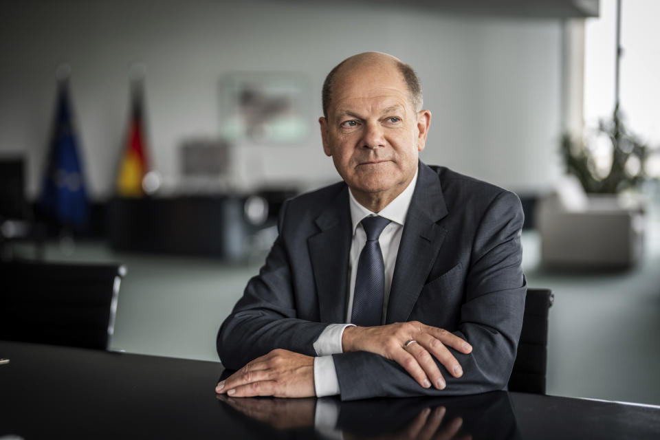 German Chancellor Olaf Scholz poses during an interview in his office at the Chancellery, in Berlin, Germany, Friday June 17, 2022. (Michael Kappeler/dpa via AP)