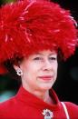 <p>The Princess wears a bold, feathered hat and matching dress to Royal Ascot on June 20, 1991.</p>