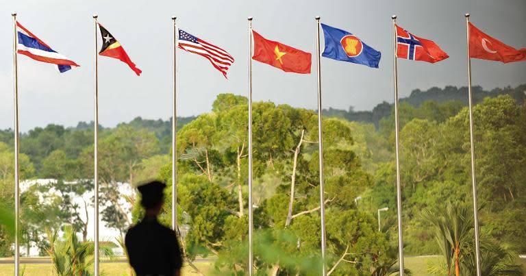 Flags of Southeast Asian Nations member countries, shown in Brunei in July 2013. Myanmar begins its first international political role in decades this week as host of Southeast Asia's regional bloc