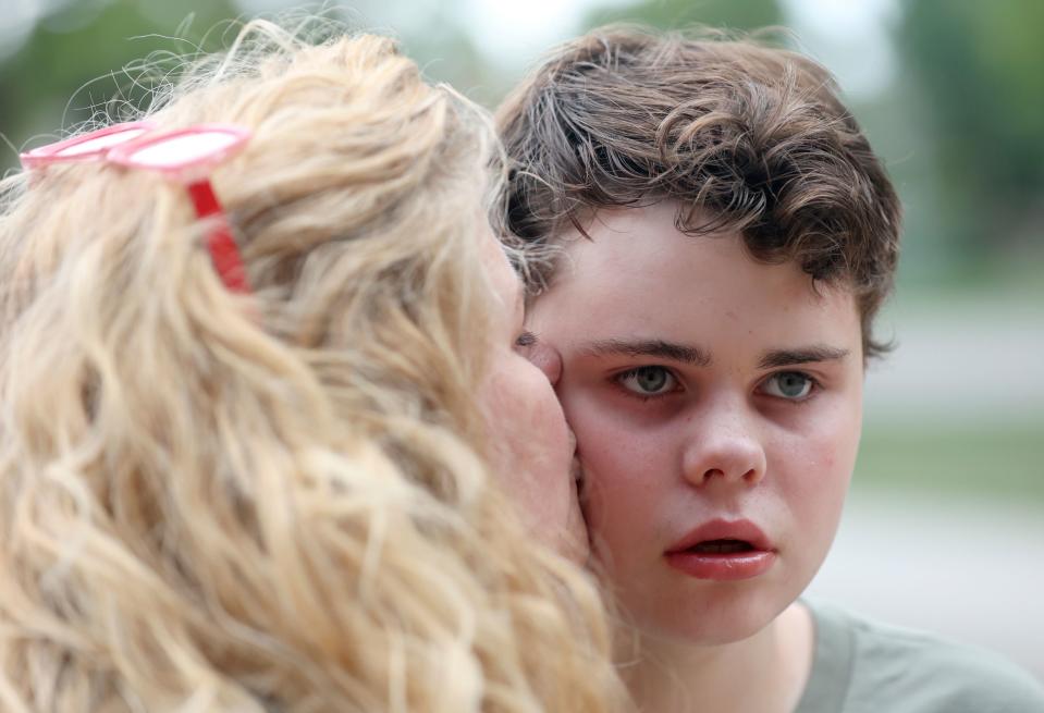 Emilie Campbell kisses her son Connor Campbell, 16, while taking a walk near their home in Provo on Sunday, May 28, 2023. Connor is autistic, nonverbal and has epilepsy. He lives at the Utah State Developmental Center in American Fork but comes home on Sundays. | Kristin Murphy, Deseret News