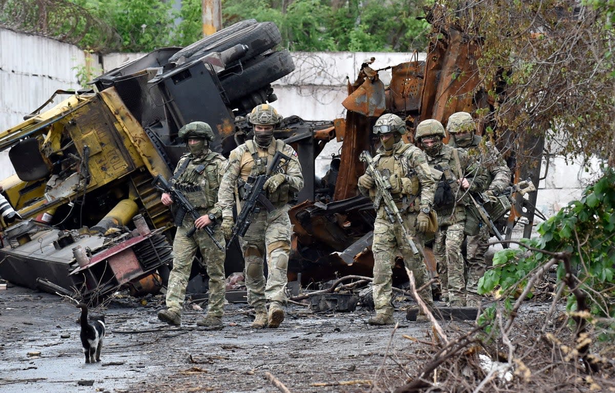 Russian servicemen patrol the destroyed part of the steel works in Ukraine's port city of Mariupol (AFP/Getty)