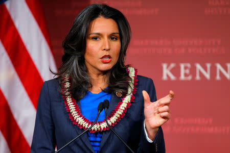 U.S. Representative Tulsi Gabbard (D-HI) speaks after being awarded a Frontier Award during a ceremony at the Kennedy School of Government at Harvard University in Cambridge, Massachusetts November 25, 2013. REUTERS/Brian Snyder/Files