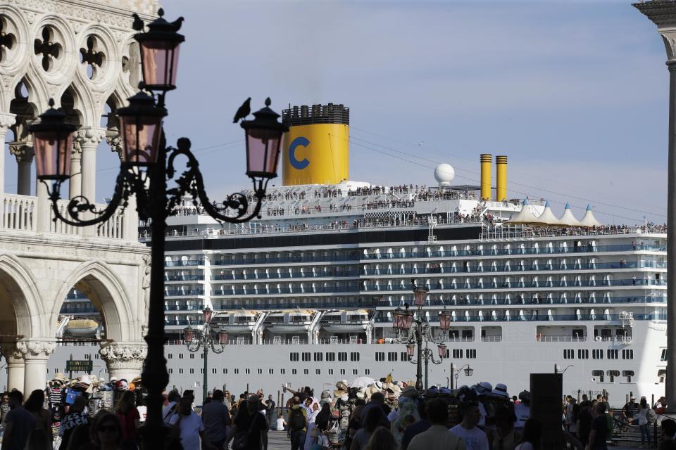 A cruise ship passes by St. Mark's Square, filled with tourists, in Venice, Italy, June 2, 2019. / Credit: Luca Bruno/AP