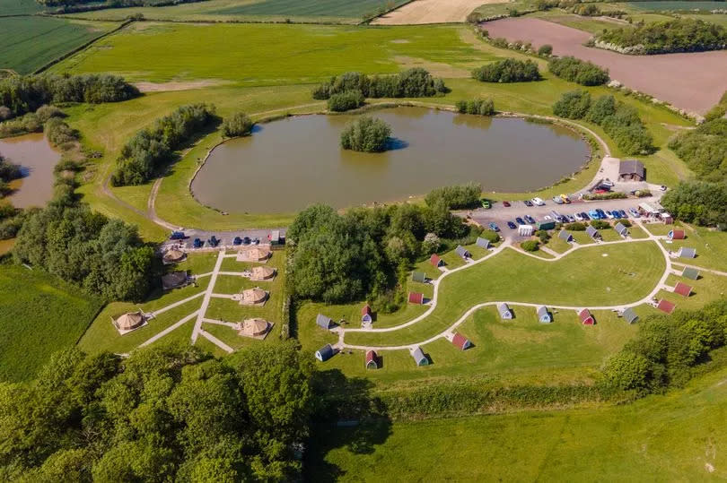 The site has pods and tents and its own fishing lake