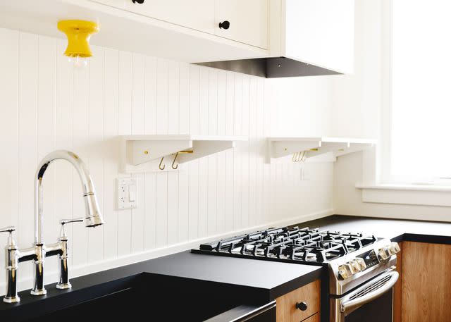 <p><a href="https://yellowbrickhome.com/our-diy-beadboard-shelves-backsplash/" data-component="link" data-source="inlineLink" data-type="externalLink" data-ordinal="1">Yellow Brick Home</a></p>