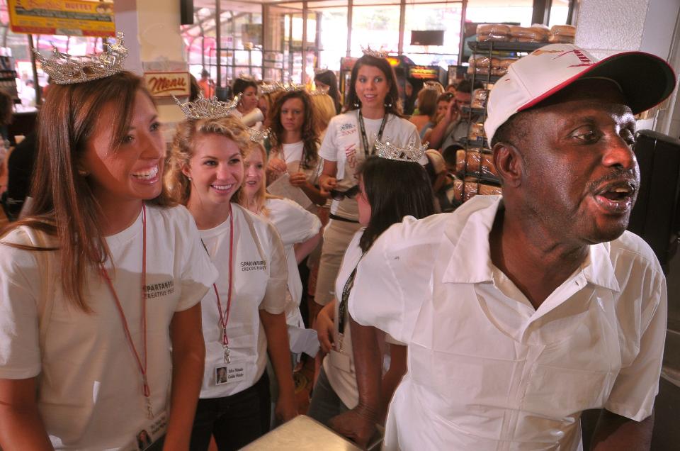 Miss South Carolina contestants give their lunch orders to J.C. Stroble, right, as he calls out the orders at the Beacon Drive-In in Spartanburg, Saturday afternoon, June 28, 2008. 