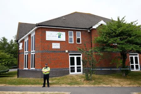 A police officer stands in front of Amesbury Baptist Church, which has been cordoned off after two people were hospitalised and police declared a 'major incident', in Amesbury, Wiltshire, Britain, July 4, 2018. REUTERS/Henry Nicholls