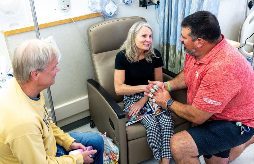 Melissa Dodds and her care partner meet former New England Patriot, Super Bowl Champion and cancer survivor Joe Andruzzi at Dartmouth Cancer Center on Sept. 13, 2023.