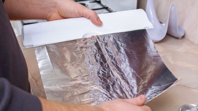 tearing off foil