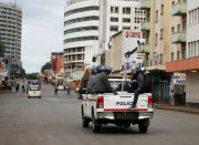 Zimbabwe Police officers are seen driving along the streets of Harare, Zimbabwe, January 17, 2019. REUTERS/Philimon Bulawayo