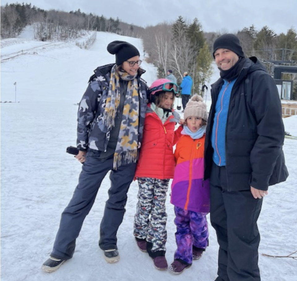 four people in a snowy scene