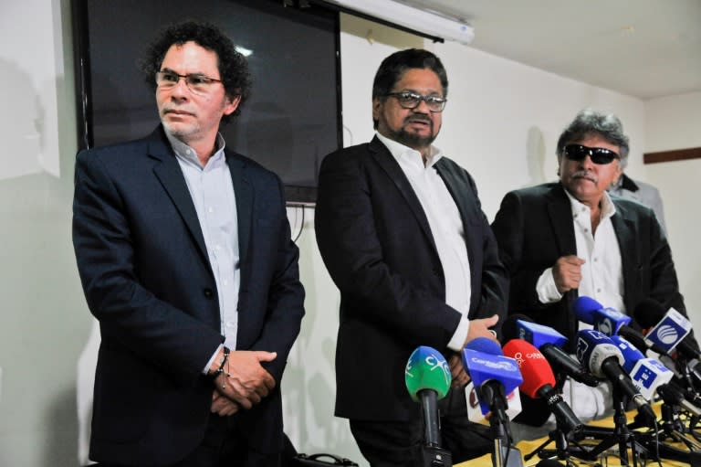 FARC-EP leftist guerrilla commanders Pastor Alape (L), Ivan Marquez (C) and Jesus Santrich (R) give a press conference in Bogota, Colombia, on February 28, 2017, to talk about the initial phase of the disarmament process