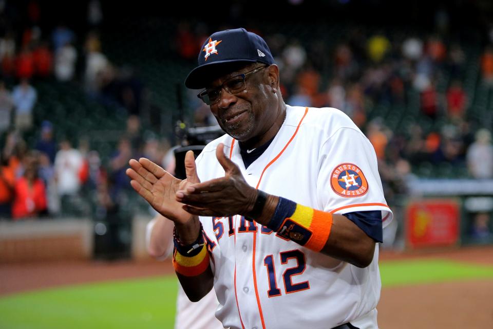 Astros manager Dusty Baker acknowledges the fans following his the 2,000th win.