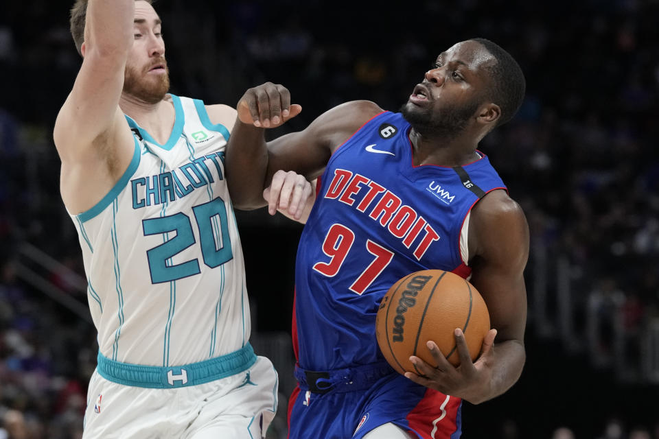 Detroit Pistons forward Eugene Omoruyi (97) runs into Charlotte Hornets forward Gordon Hayward (20) during the first half of an NBA basketball game, Thursday, March 9, 2023, in Detroit. (AP Photo/Carlos Osorio)