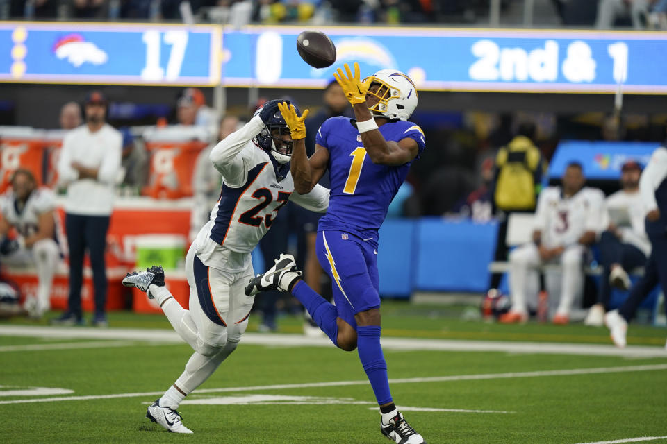 Los Angeles Chargers wide receiver Quentin Johnston (1) hauls in a pass as Denver Broncos cornerback Fabian Moreau (23) defends during the second half of an NFL football game Sunday, Dec. 10, 2023, in Inglewood, Calif. (AP Photo/Ryan Sun)