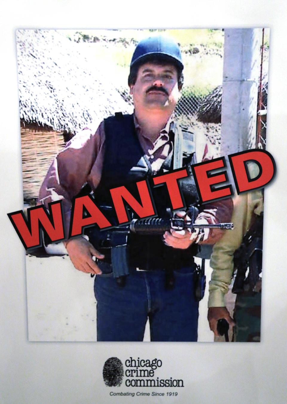 FILE - In a Thursday, Feb. 14, 2013, file photo, a poster displayed at a Chicago Crime Commission news conference in Chicago, shows Joaquin ``El Chapo'' Guzman, who was deemed Chicago's Public Enemy No. 1. A senior U.S. law enforcement official said Saturday, Feb. 22, 2014 that Guzman, the head of Mexico's Sinaloa Cartel, was captured alive overnight in the beach resort town of Mazatlan, Mexico. Guzman faces multiple federal drug trafficking indictments in the U.S. and is on the Drug Enforcement Administration?s most-wanted list. His cartel has been heavily involved in the bloody drug war that has torn through parts of Mexico for the last several years. (AP Photo/M. Spencer Green, File)