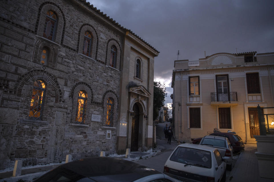In this Wednesday, April 15, 2020, photo the Greek Orthodox church of Agios Nikolaos is seen on the left, in Plaka district of Athens, Greece, during a lockdown order by the government to prevent the spread of the coronavirus. For Orthodox Christians, this is normally a time of reflection, communal mourning and joyful release, of centuries-old ceremonies steeped in symbolism and tradition. But this year, Easter - by far the most significant religious holiday for the world's roughly 300 million Orthodox - has essentially been cancelled. (AP Photo/Petros Giannakouris)