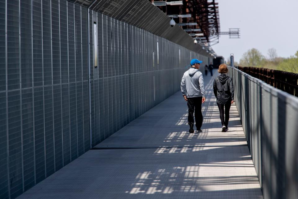 Few people walk across the Big River Crossing on Wednesday, April 1, 2020, in Memphis.