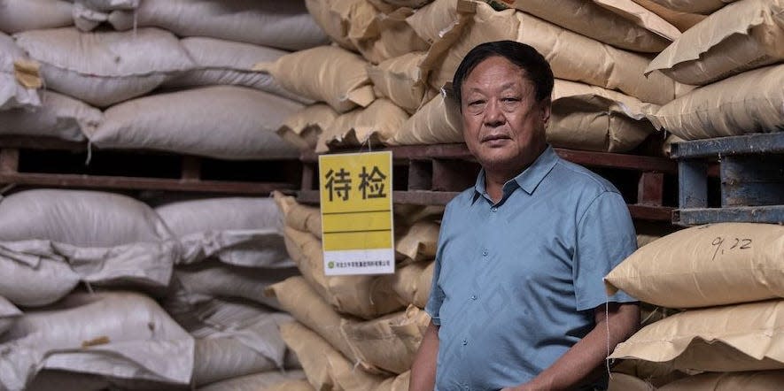 Chinese pig farmer Sun Dawu posing at a feed warehouse in Hebei, outside Beijing