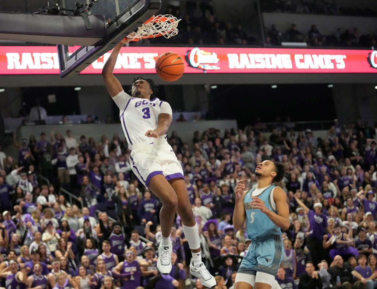 Nov 9, 2022; Phoenix, Ariz., U.S.;  Grand Canyon guard Kobe Knox (3) dunks the ball against San Diego Christian forward Greg Chew Jr. (5) during the second half at GCU Arena. Mandatory Credit: Michael Chow-Arizona Republic