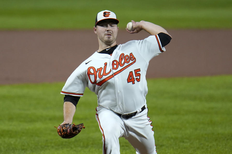 Baltimore Orioles starting pitcher Keegan Akin throws a pitch to the Atlanta Braves during the first inning of a baseball game, Wednesday, Sept. 16, 2020, in Baltimore. (AP Photo/Julio Cortez)