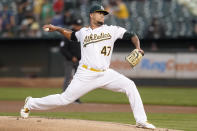 Oakland Athletics' Frankie Montas pitches against the Houston Astros during the first inning of a baseball game in Oakland, Calif., Friday, Sept. 24, 2021. (AP Photo/Jeff Chiu)