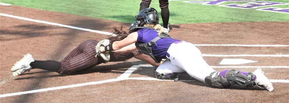 Wylie catcher Cameron Gregory, right, tags out Aledo's Ana Flores for the final out in the top of the seventh inning.