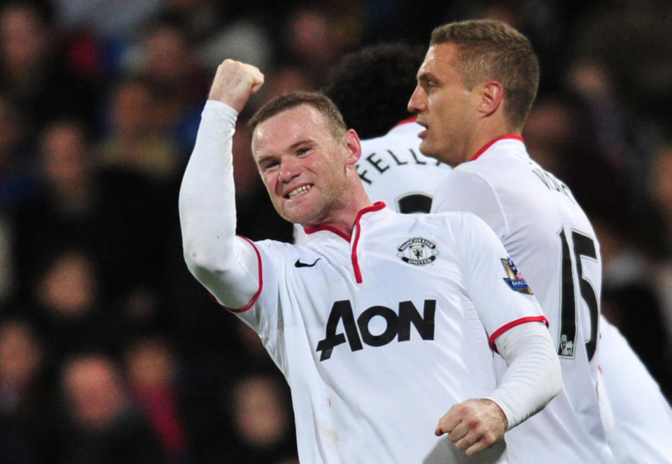 El delantero inglés del Manchester United, Wayne Rooney, celebra su gol anotado ante el Crystal Palace en el encuentro de Premier League disputado en Londres, el 22 de febrero de 2014 (AFP | Carl Court)