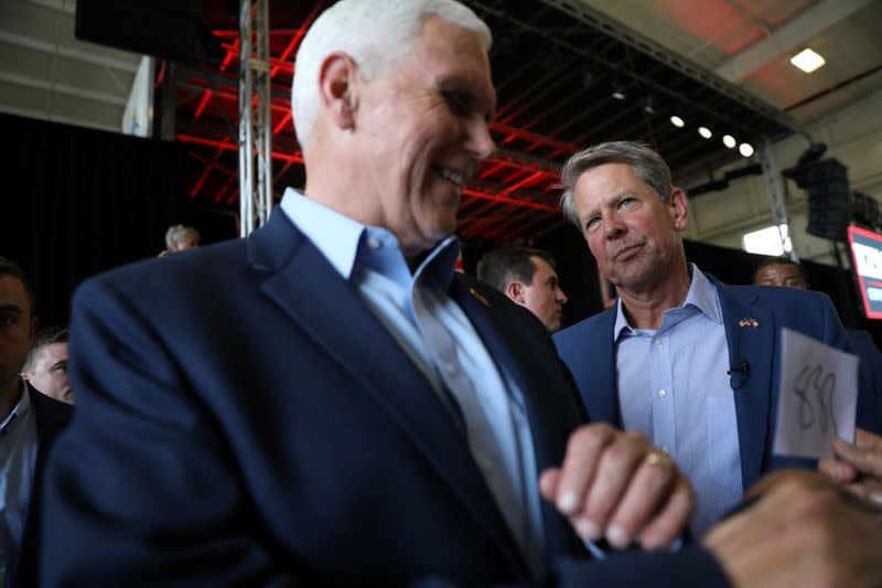 Former Vice President Mike Pence and Georgia Governor Brian Kemp attend a rally ahead of the state's Republican primary in Kennesaw