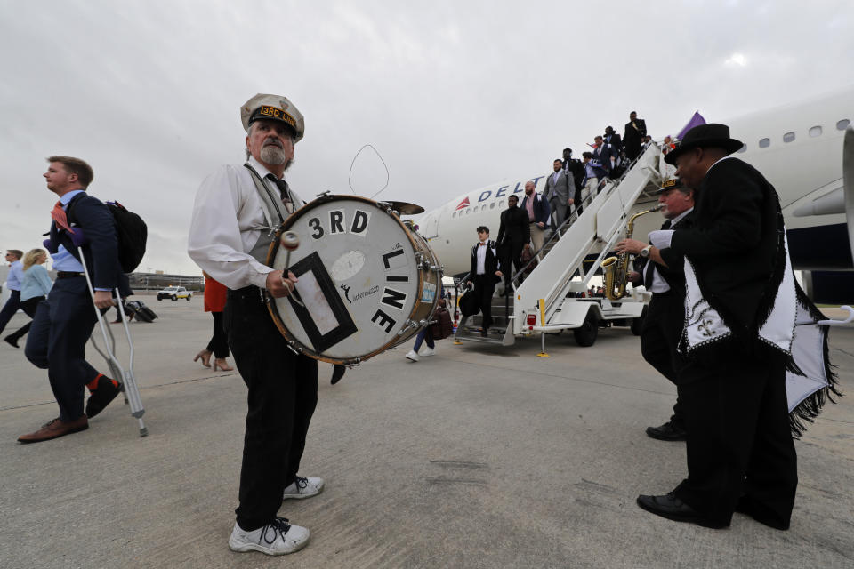 The 3rd Line Brass Band performs as Clemson arrives in New Orleans for the NCAA College Football Playoff title game, Friday, Jan. 10, 2020. Clemson is scheduled to play LSU on Monday. (AP Photo/Gerald Herbert)