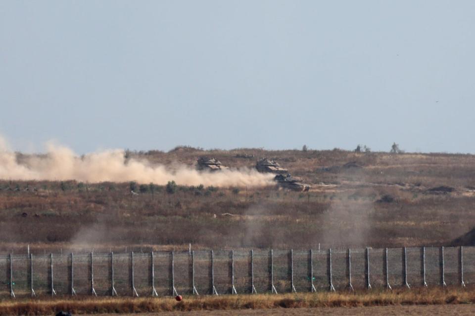 Israeli tanks drive across the security fence with Jabalia in northern part of the Gaza Strip (EPA)